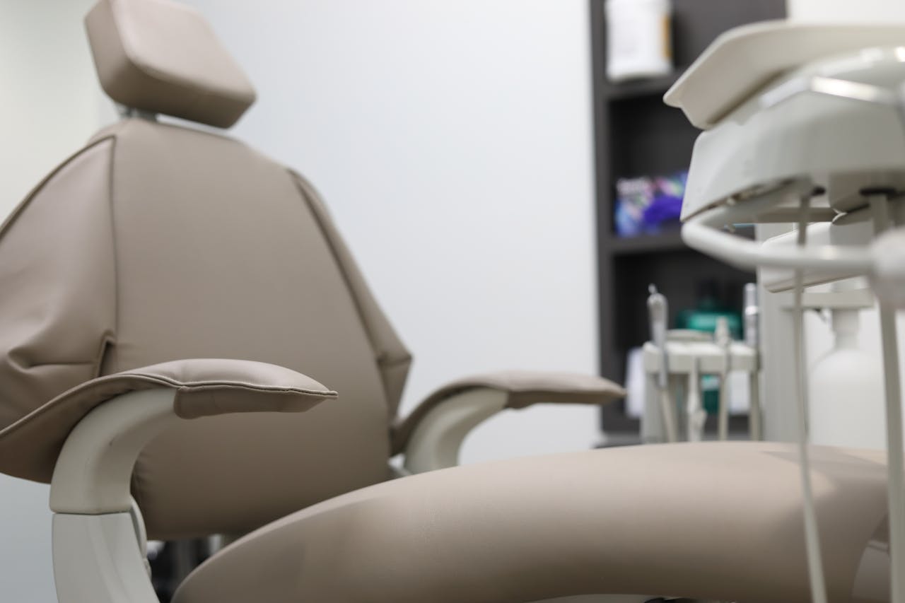 services-02 Close-up of dental chair and equipment in a clinical setting, emphasizing healthcare technology.